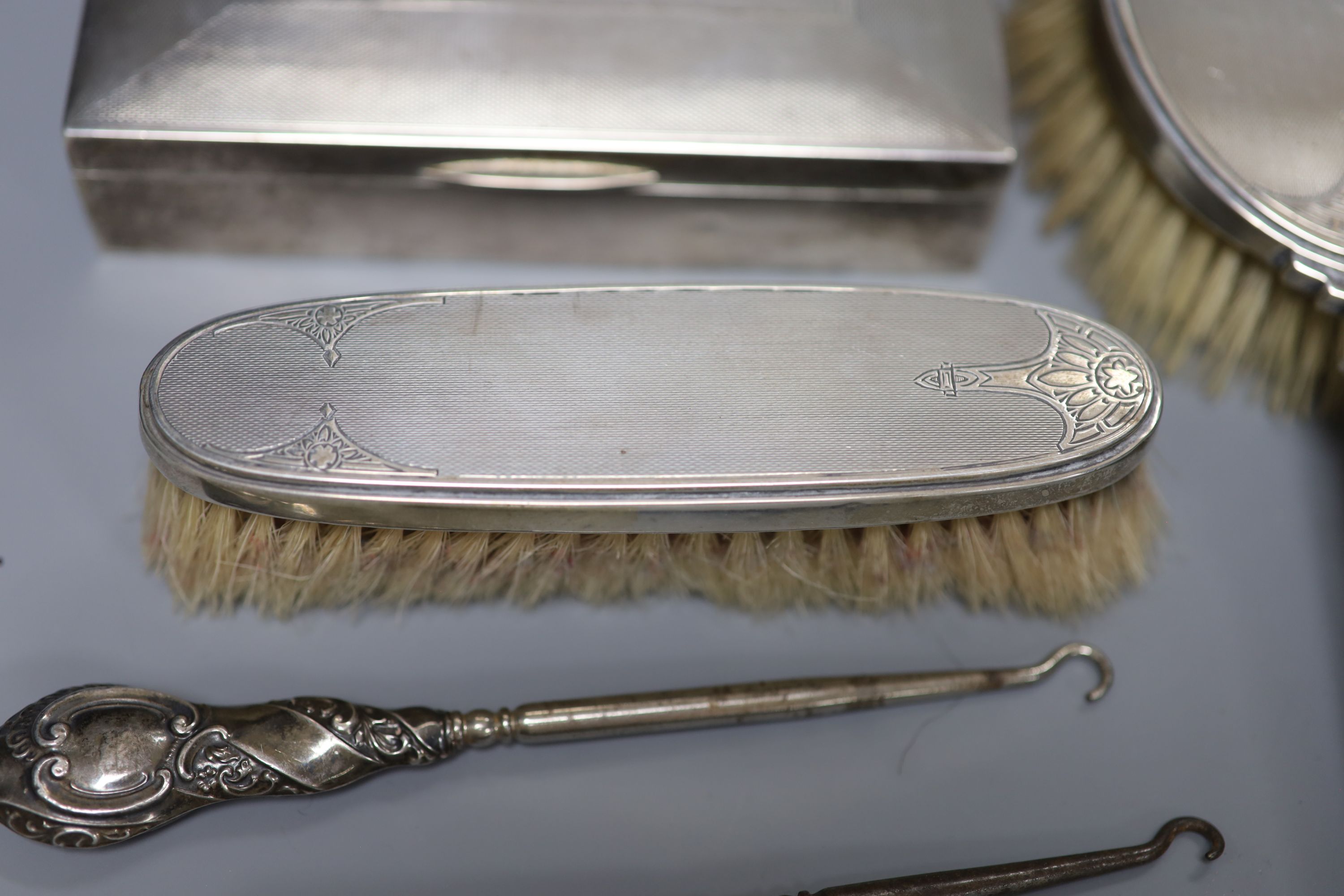 A silver cigarette case, brush set, cased spoons etc and a late Victorian miniature silver settee, Sheffield, 1897.